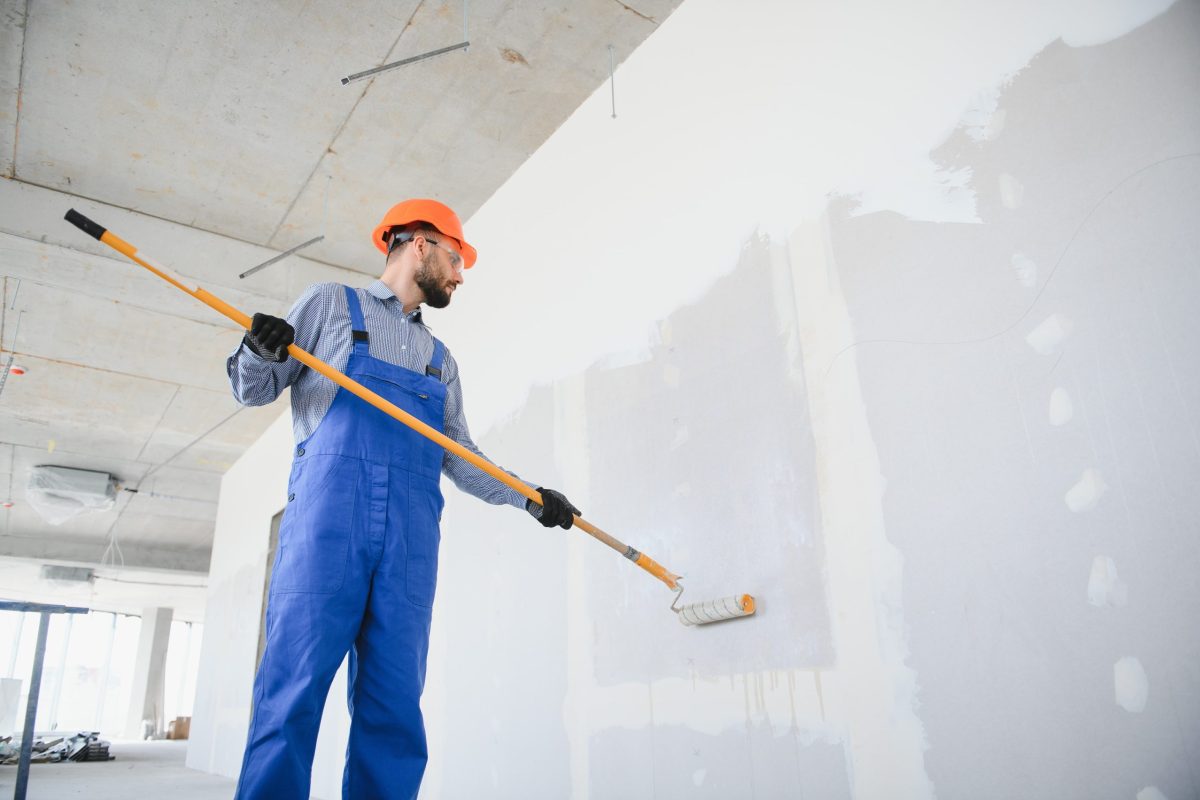 painter-man-painting-the-wall-with-paint-roller-2023-11-27-05-13-34-utc-min